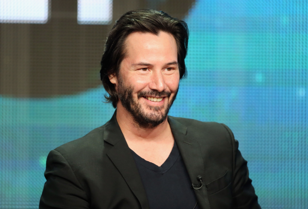 Keanu Reeves and Alexandra Grant showcasing their creative partnership
